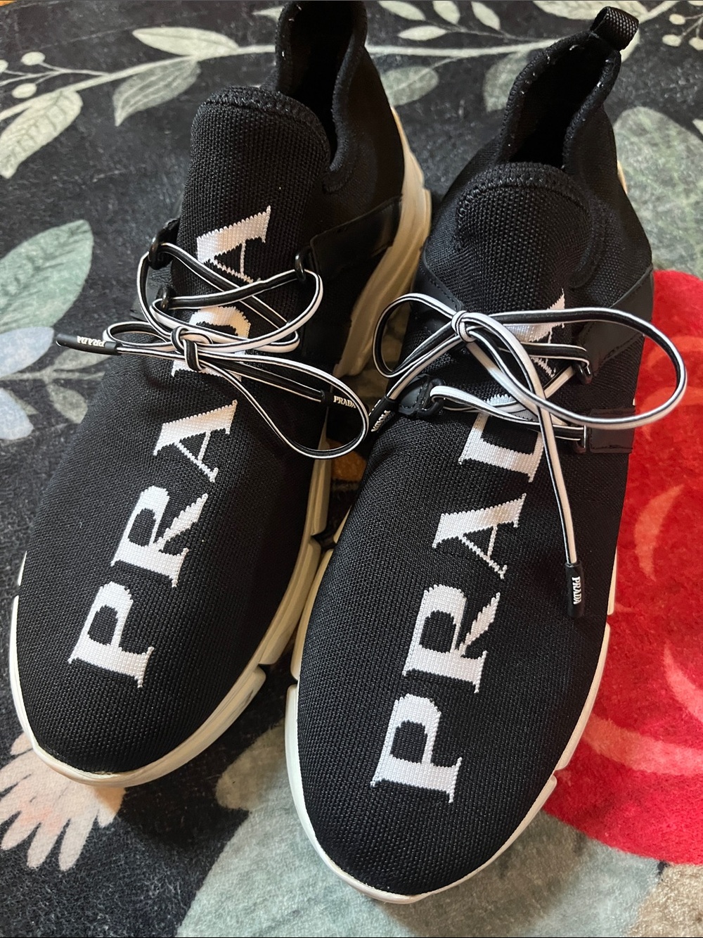 Prada Black and White Knit Logo Slip-On Sneakers